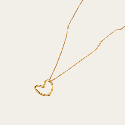 Time4Me gold-toned stainless steel necklace featuring a minimalist stylized heart pendant on a delicate chain.