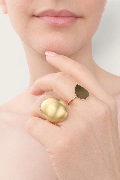 Time4Me gold teardrop ring worn on a finger with a brushed finish, made of durable stainless steel.