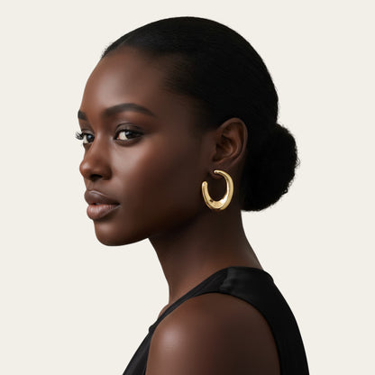 Time4Me gold open hoop earrings worn by a woman with a sleek bun, featuring a thick, polished stainless steel design.
