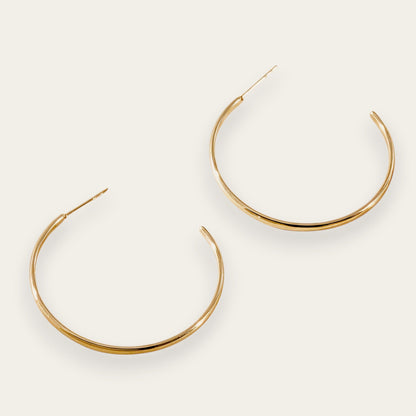 Time4Me gold-tone thin hoop earrings made of durable stainless steel for a versatile and lightweight everyday look.