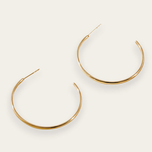 Time4Me gold-tone thin hoop earrings made of durable stainless steel for a versatile and lightweight everyday look.