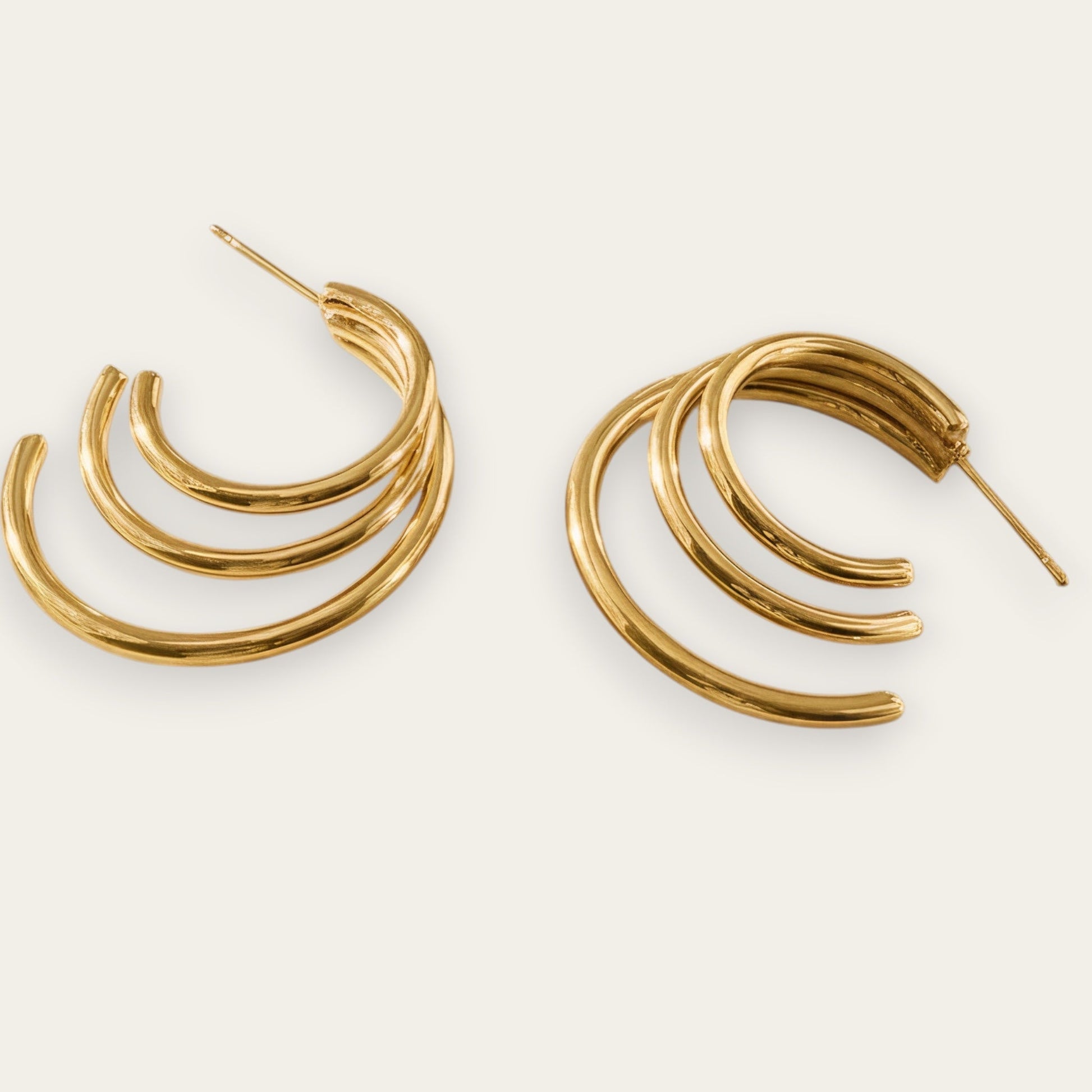 Time4Me gold-tone stainless steel triple hoop earrings with a polished finish for a versatile everyday look.