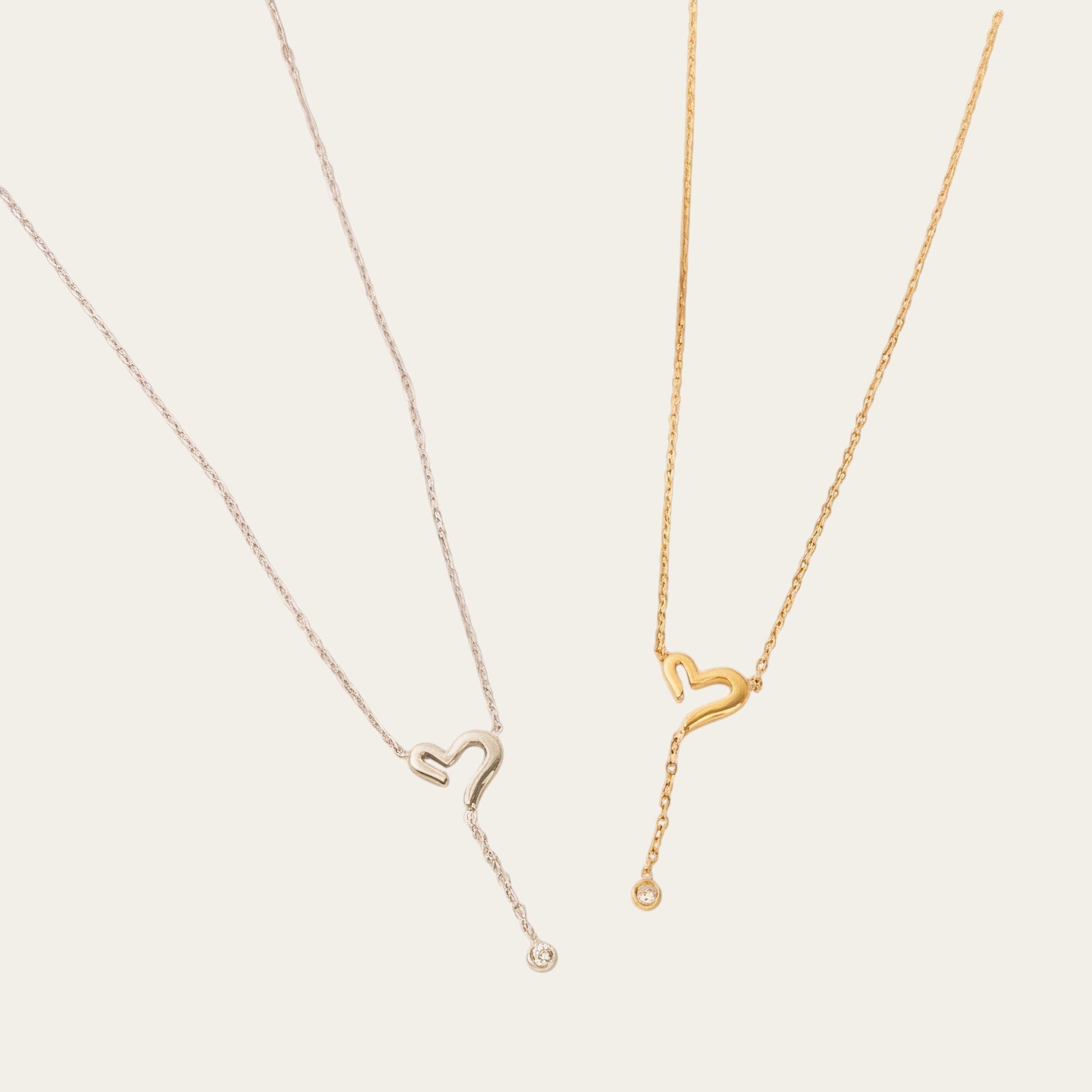 Time4Me gold and silver tone stainless steel necklaces featuring open heart pendants with a delicate hanging crystal.
