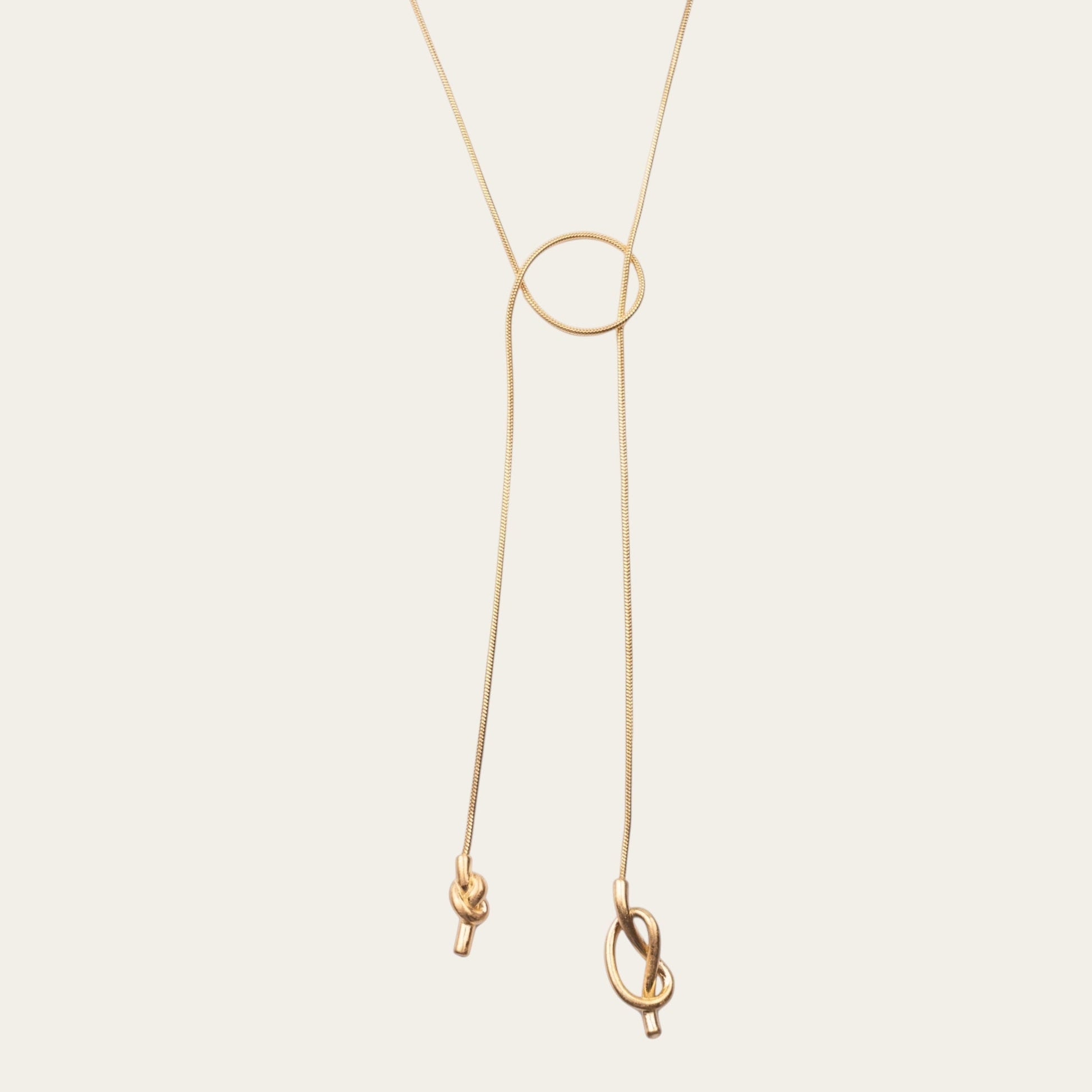Time4Me gold stainless steel long necklace with asymmetric knots and a circular pendant detail