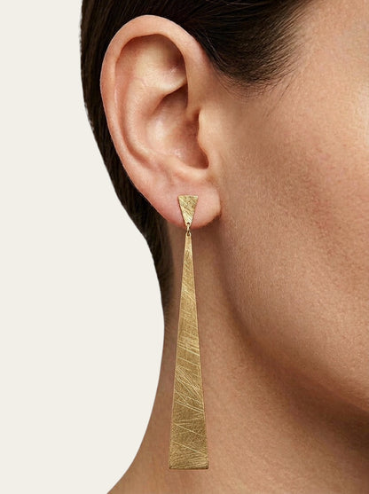 Time4Me long gold-tone stainless steel drop earrings with a brushed textured finish worn on a model