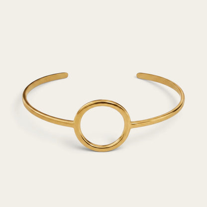 Time4Me minimalist gold-tone open cuff bracelet featuring a central circular design in stainless steel