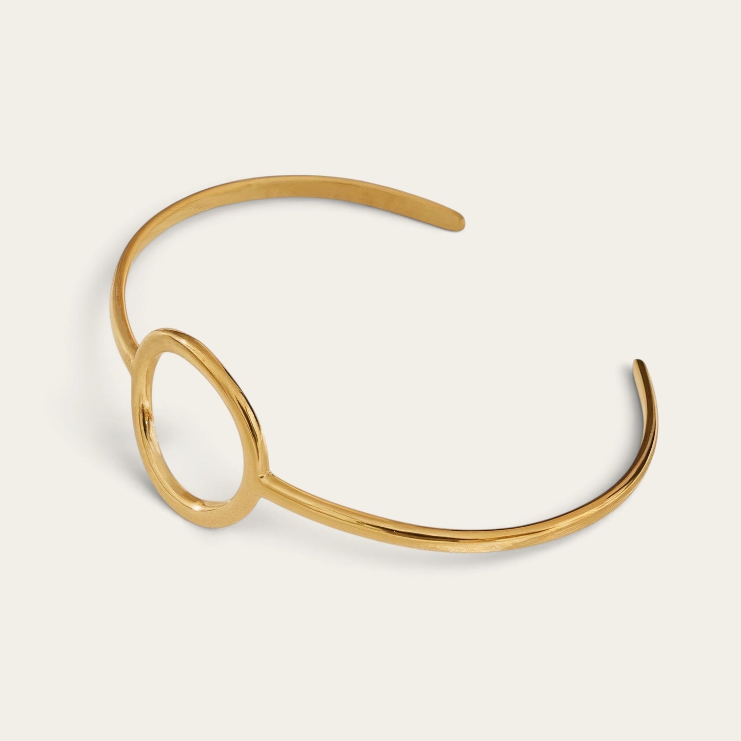 Time4Me minimalist gold open cuff bracelet with a circular center detail made of durable stainless steel.