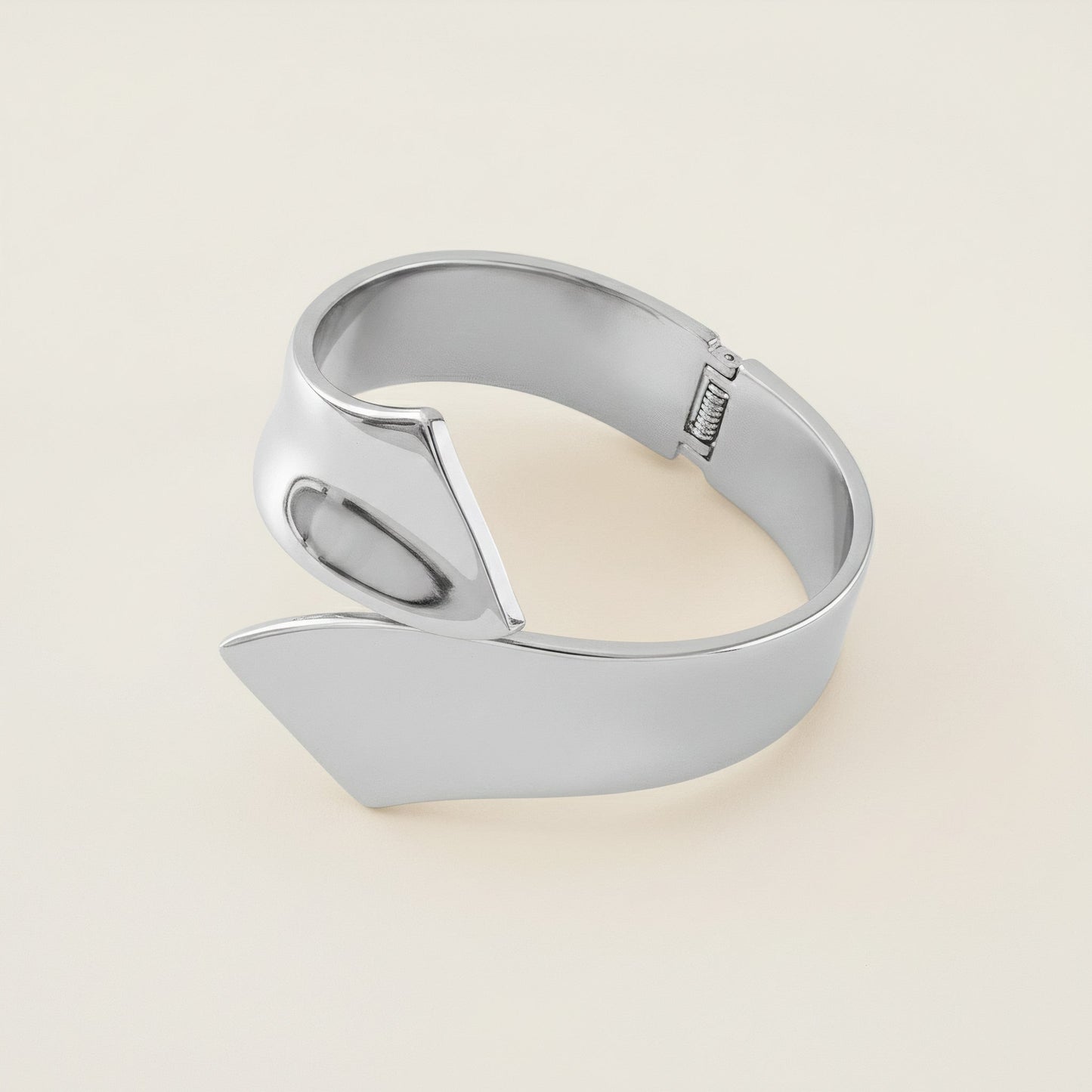 Time4Me sculptural silver-tone open cuff bracelet made of durable stainless steel with a modern wrap design.