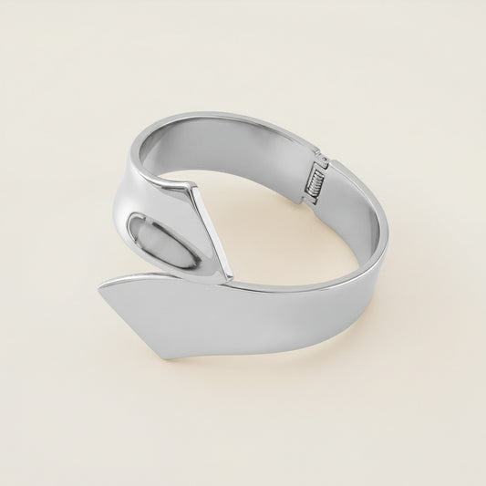 Time4Me sculptural silver-tone open cuff bracelet made of durable stainless steel with a modern wrap design.