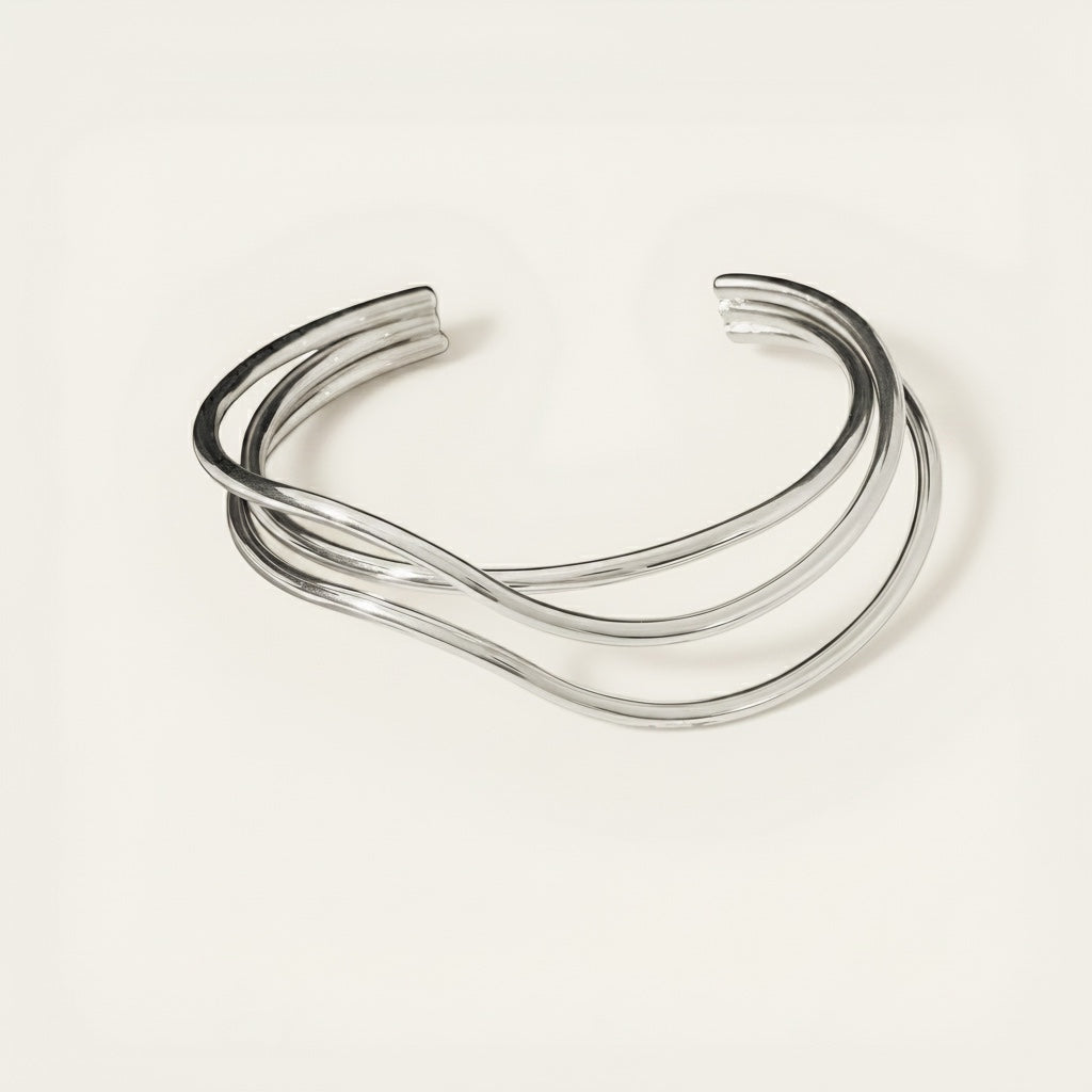 Time4Me silver open cuff bracelet featuring a modern crisscross line design made from durable stainless steel.