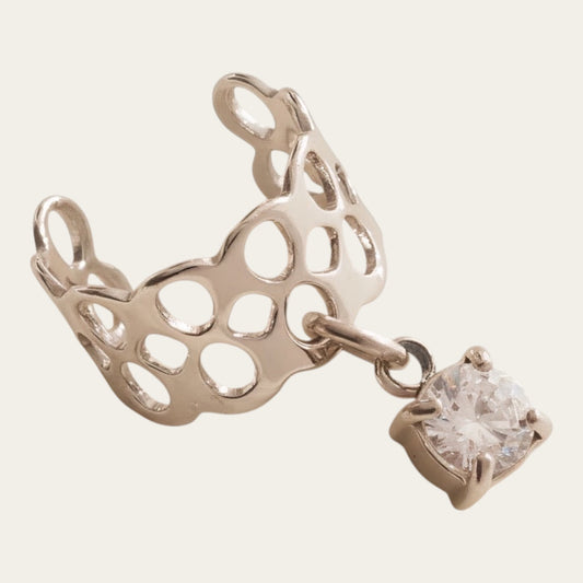 Time4Me silver stainless steel ear cuff featuring a delicate openwork design and a dangling clear crystal pendant.
