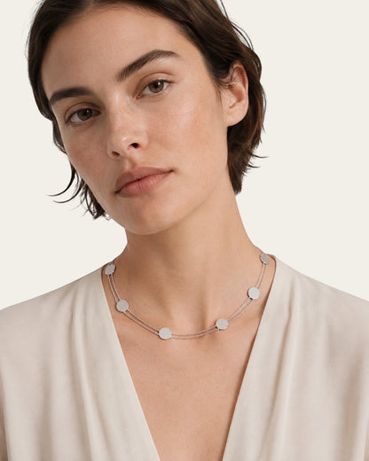 Time4Me silver double chain choker with small disc pendants worn by a woman in a cream blouse