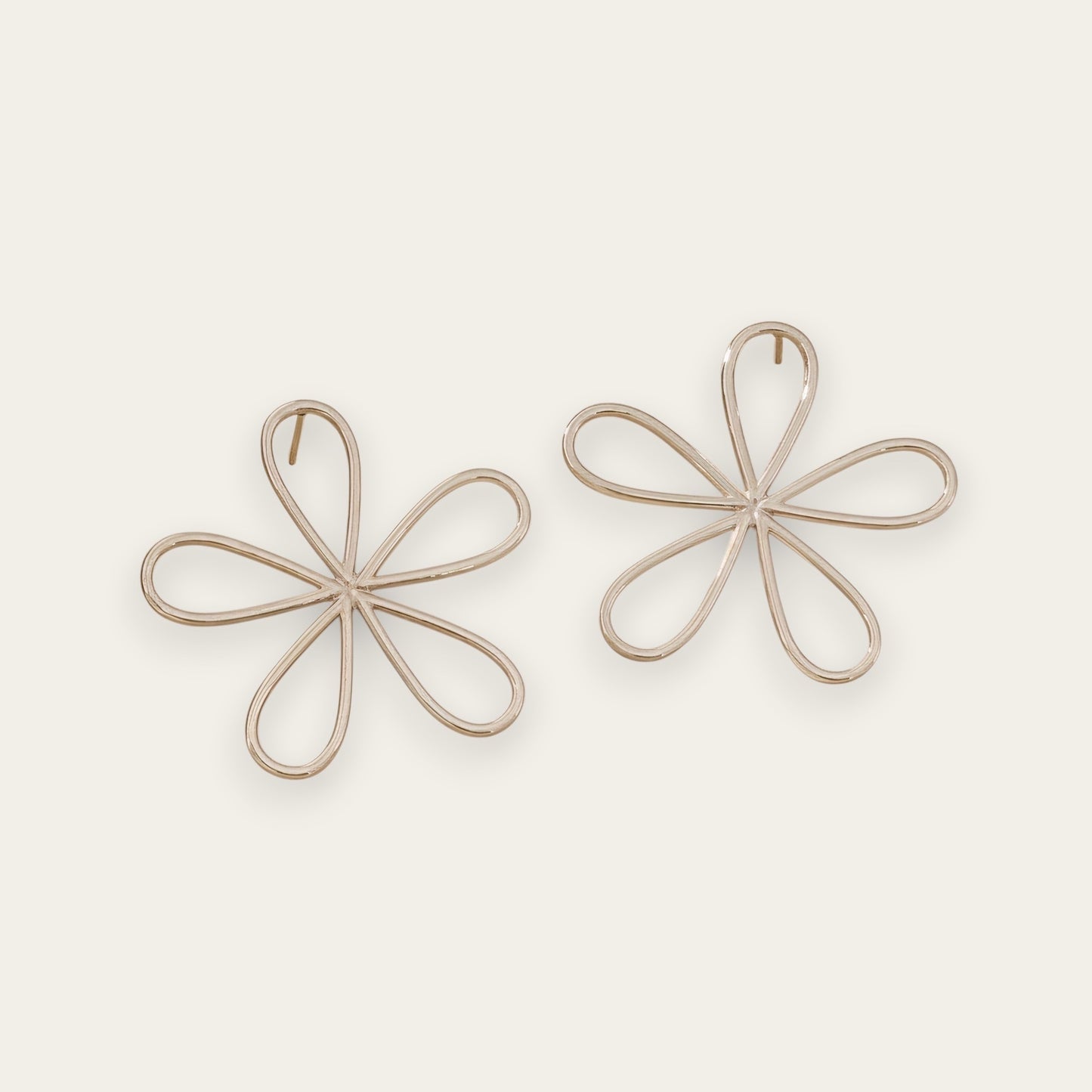 Time4Me silver-tone stainless steel stud earrings featuring a minimalist stylized flower design