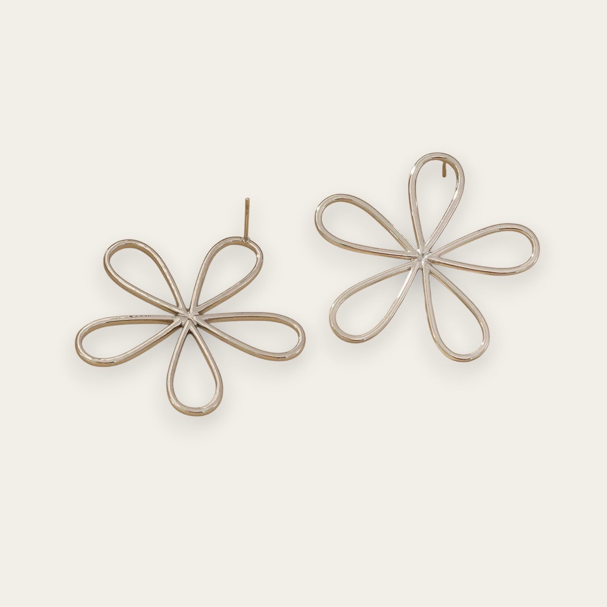 Time4Me silver-tone stainless steel stud earrings featuring a minimalist stylized flower design