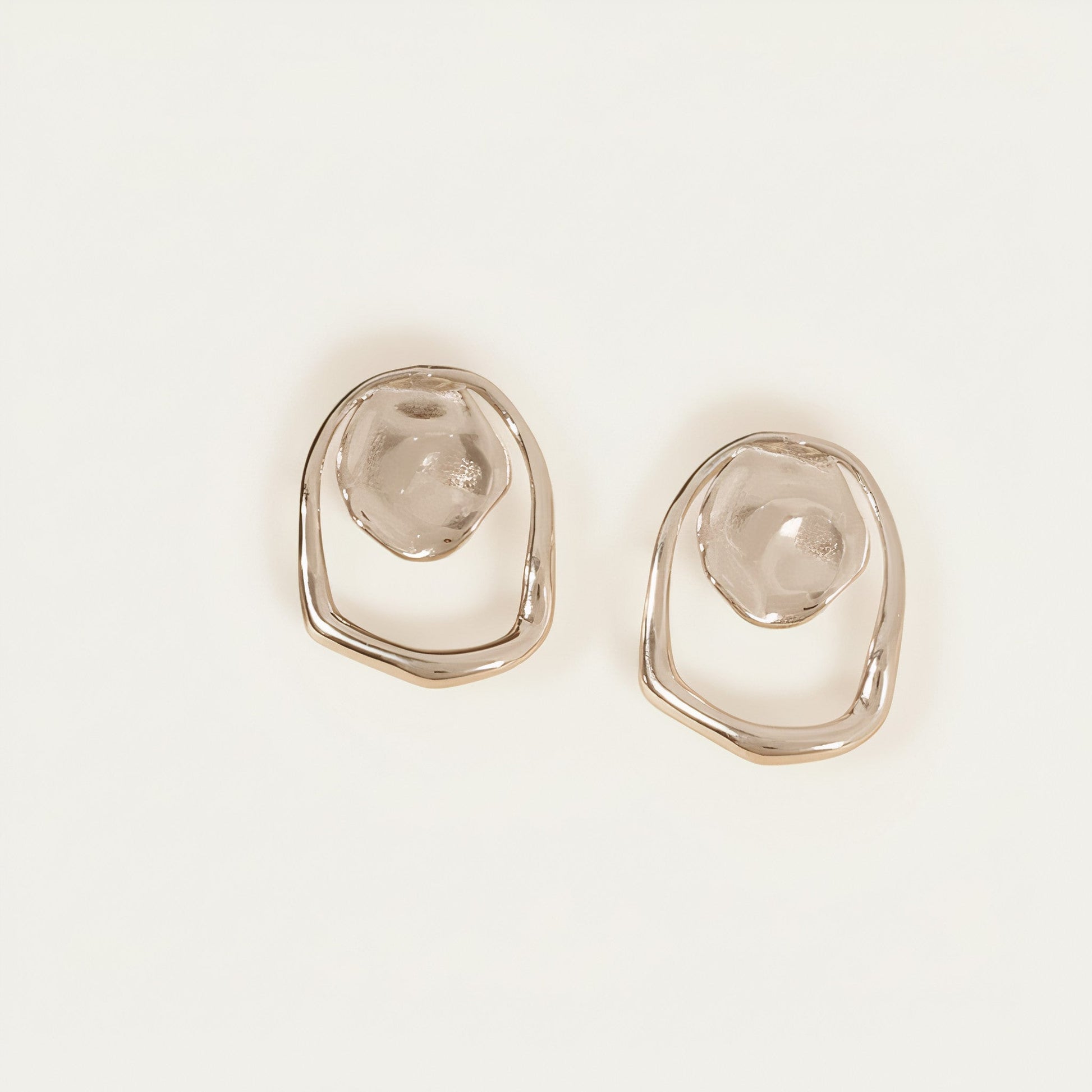 Time4Me silver geometric earrings featuring a hammered circle and irregular mirror-effect ring in stainless steel