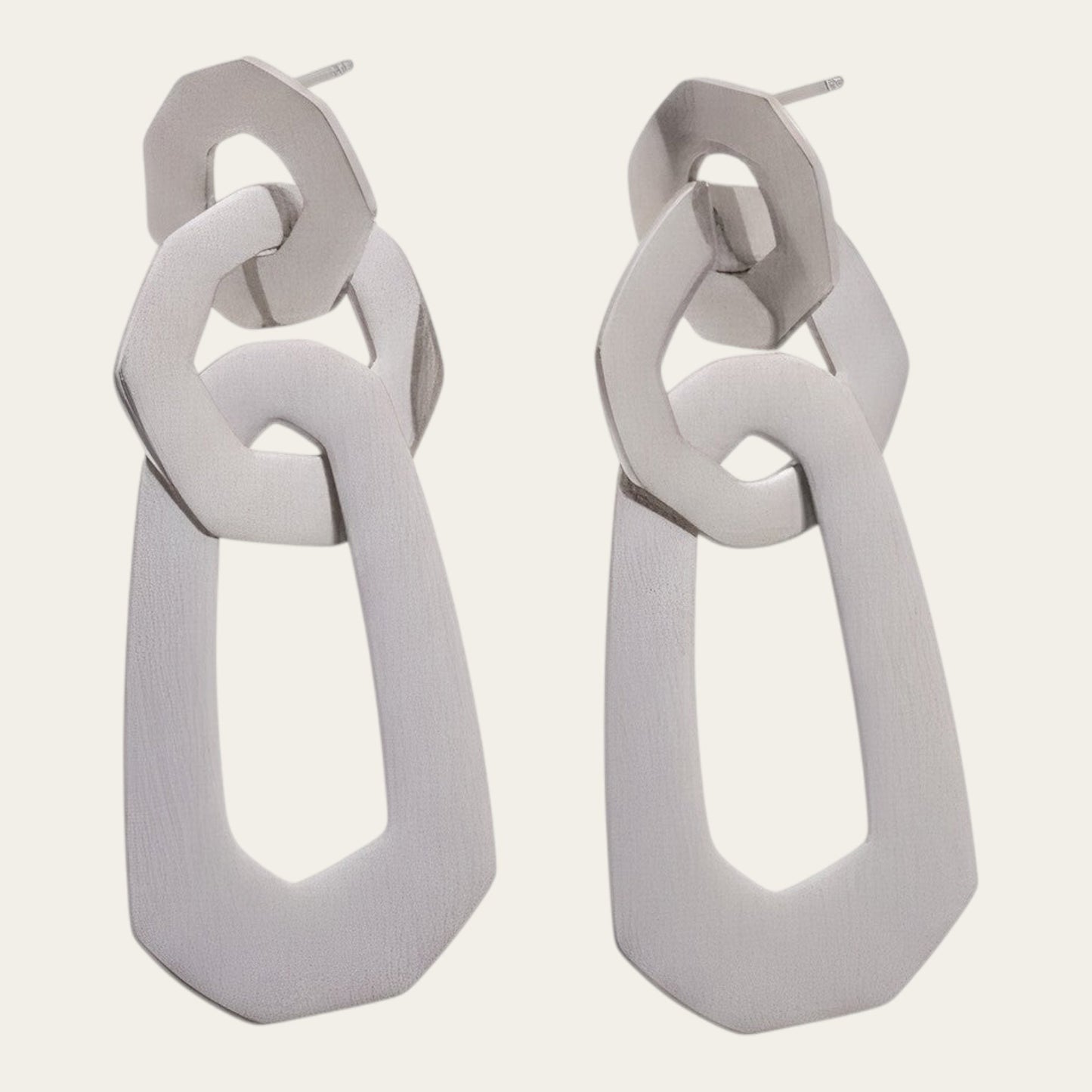 Time4Me silver-toned long earrings featuring three interconnected geometric shapes made of stainless steel.