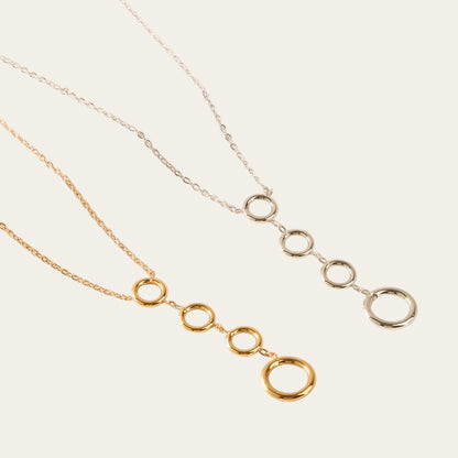 Time4Me stainless steel necklaces featuring four vertical circles in silver and gold tones on delicate chains.
