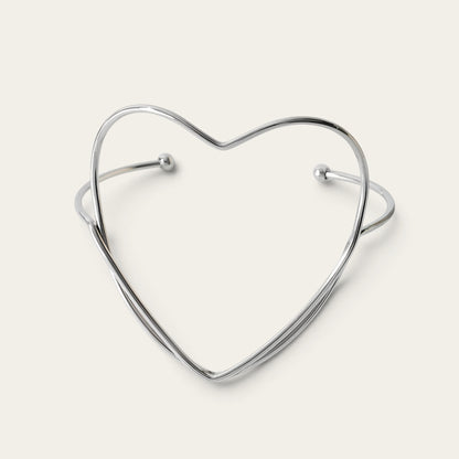 Time4Me silver-tone stainless steel open cuff bracelet featuring a minimalist heart-shaped design