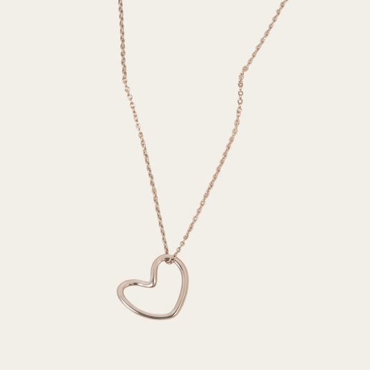 Time4Me silver-toned stainless steel necklace featuring a minimalist stylized heart pendant on a delicate chain.