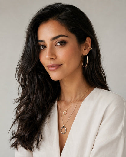 Time4Me silver hoop earrings worn by a woman with long dark hair, featuring a minimalist and lightweight design.