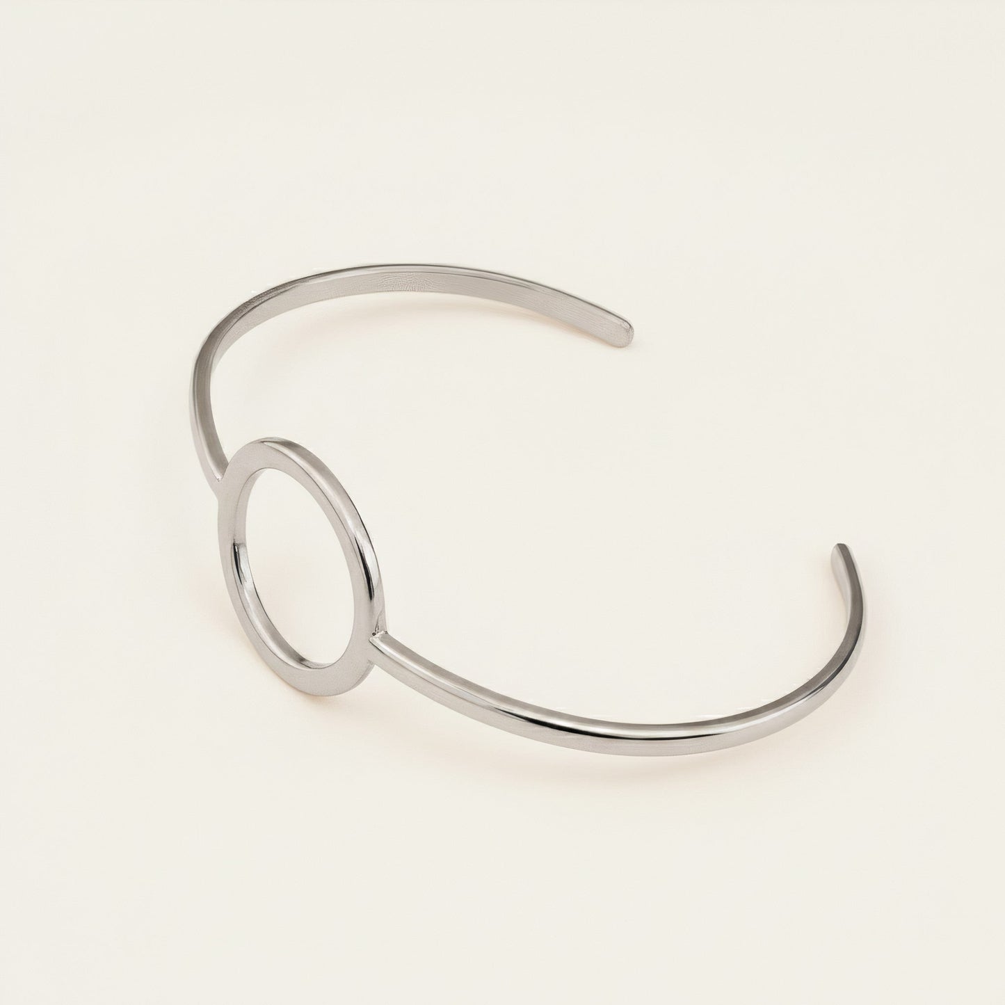 Time4Me minimalist silver-tone open cuff bracelet with a circular center detail made from durable stainless steel.