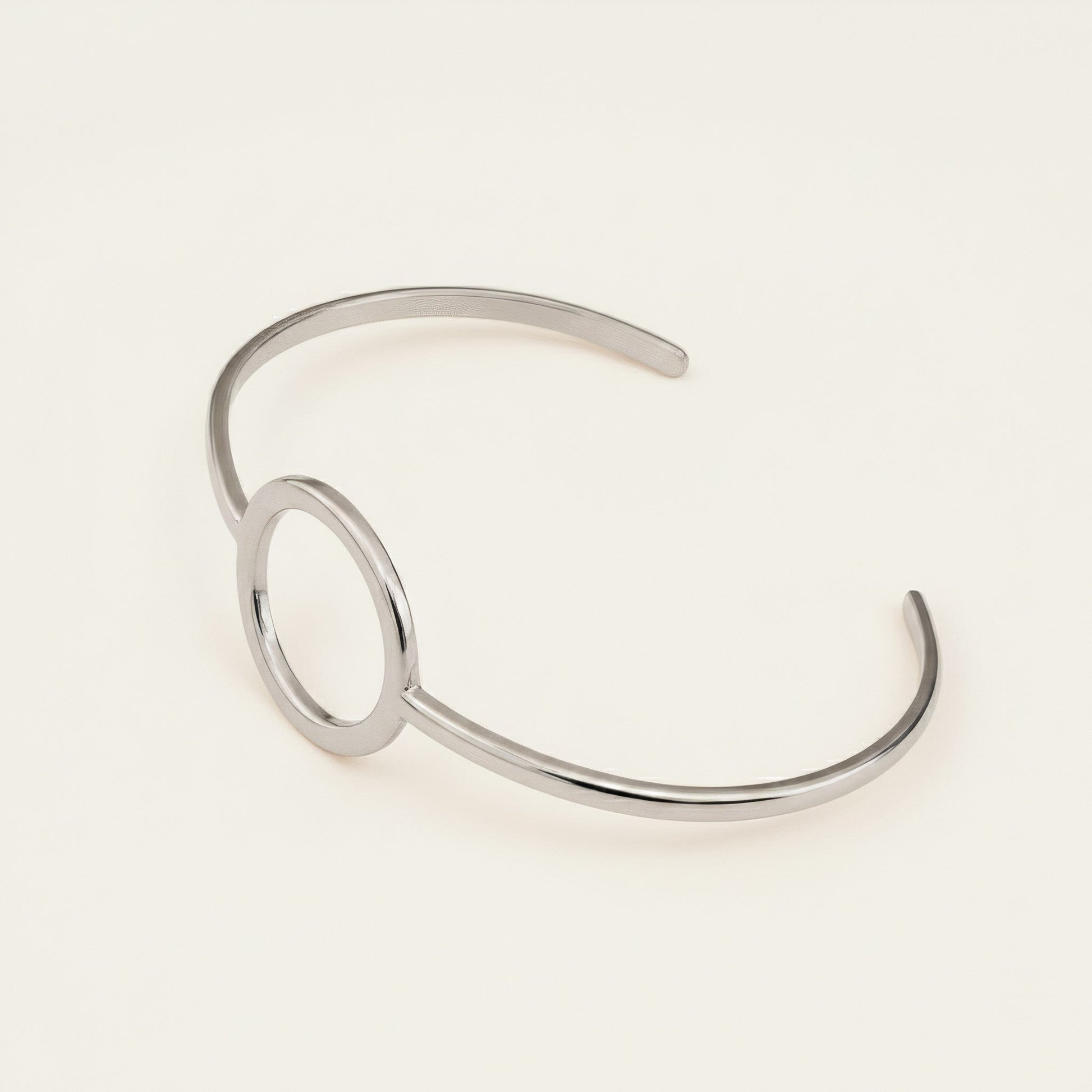 Time4Me minimalist silver-tone open cuff bracelet with a circular center detail made from durable stainless steel.