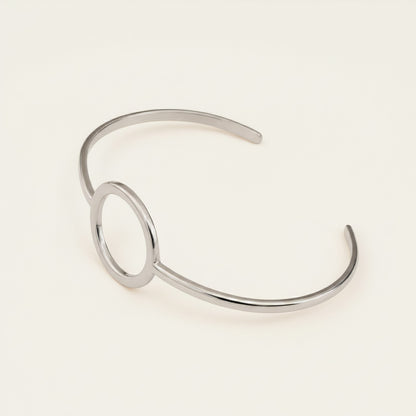 Time4Me minimalist silver-tone open cuff bracelet with a circular center detail made from durable stainless steel.