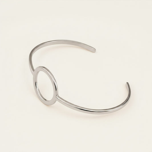 Time4Me minimalist silver-tone open cuff bracelet with a circular center detail made from durable stainless steel.