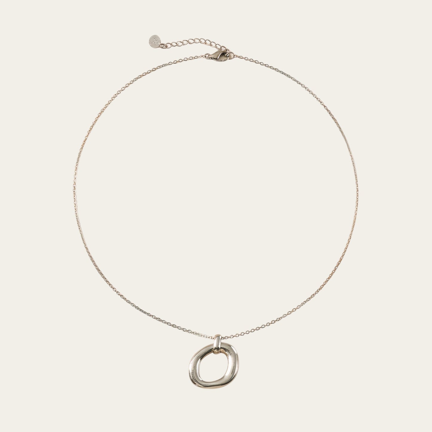 Time4Me silver-tone stainless steel necklace featuring a minimalist oval pendant with a relief design.