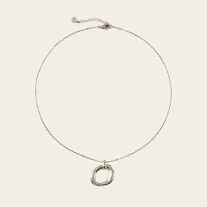 Time4Me silver-tone stainless steel necklace featuring a minimalist oval pendant with a relief design.