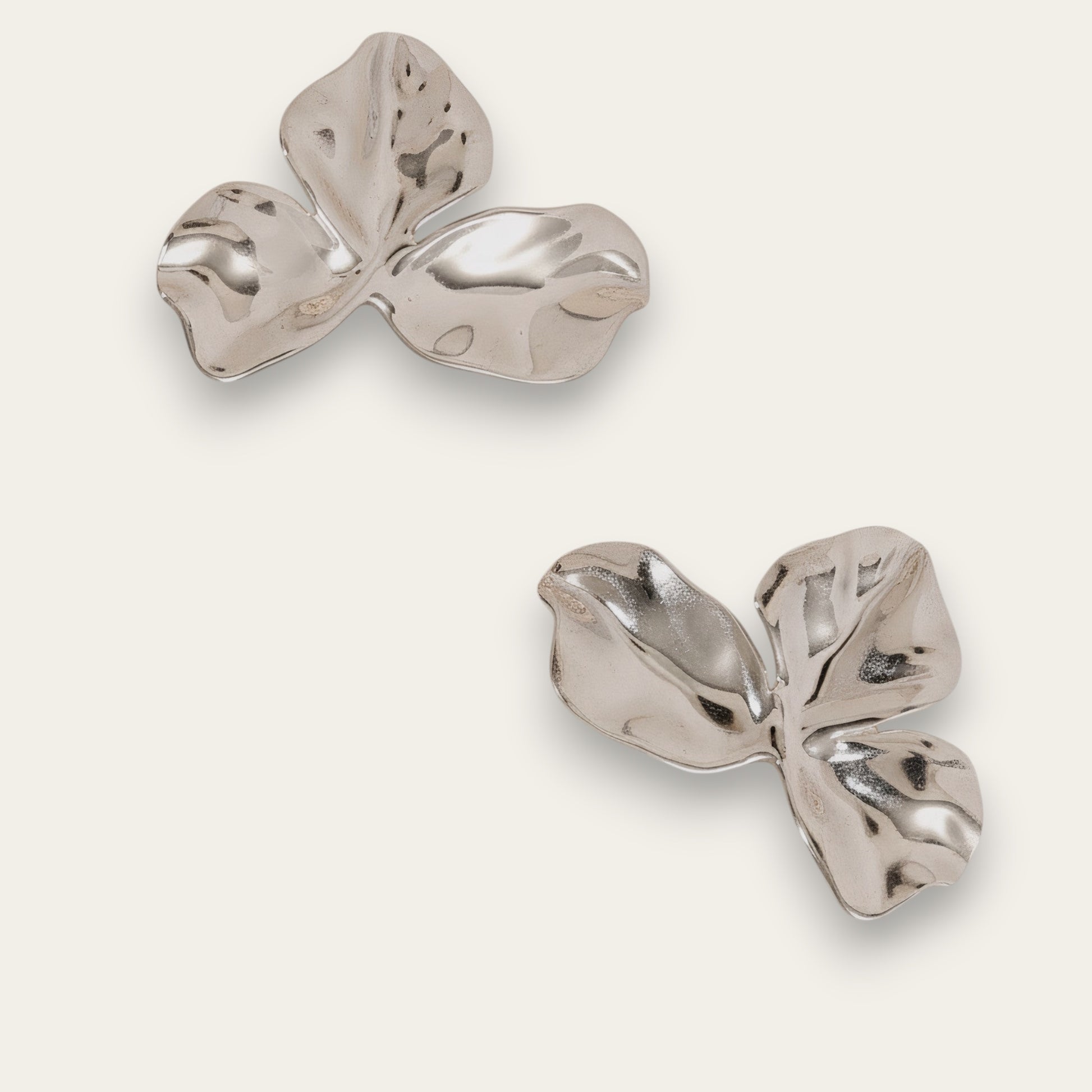 Time4Me silver-toned stainless steel petal-shaped earrings with a polished, organic design.