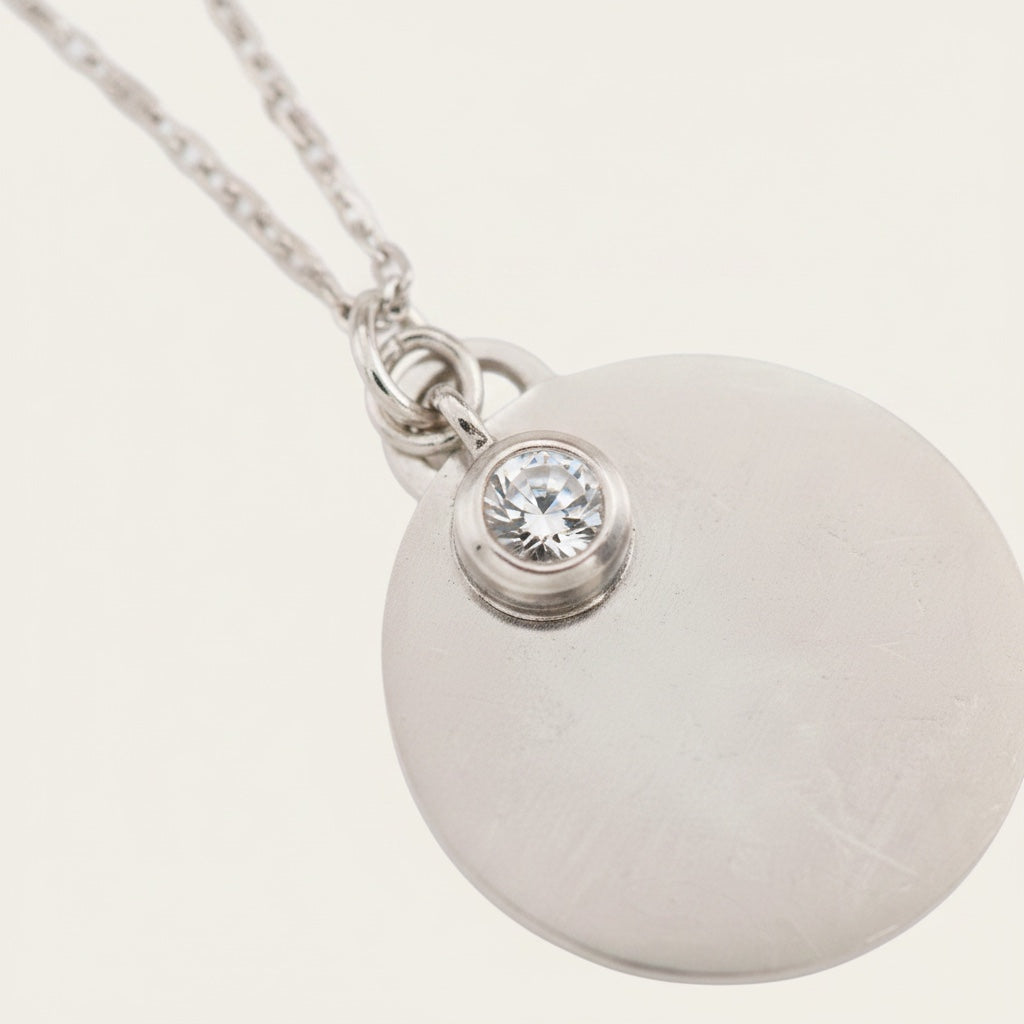 Time4Me silver stainless steel necklace with a round pendant for engraving and a single sparkling rhinestone accent