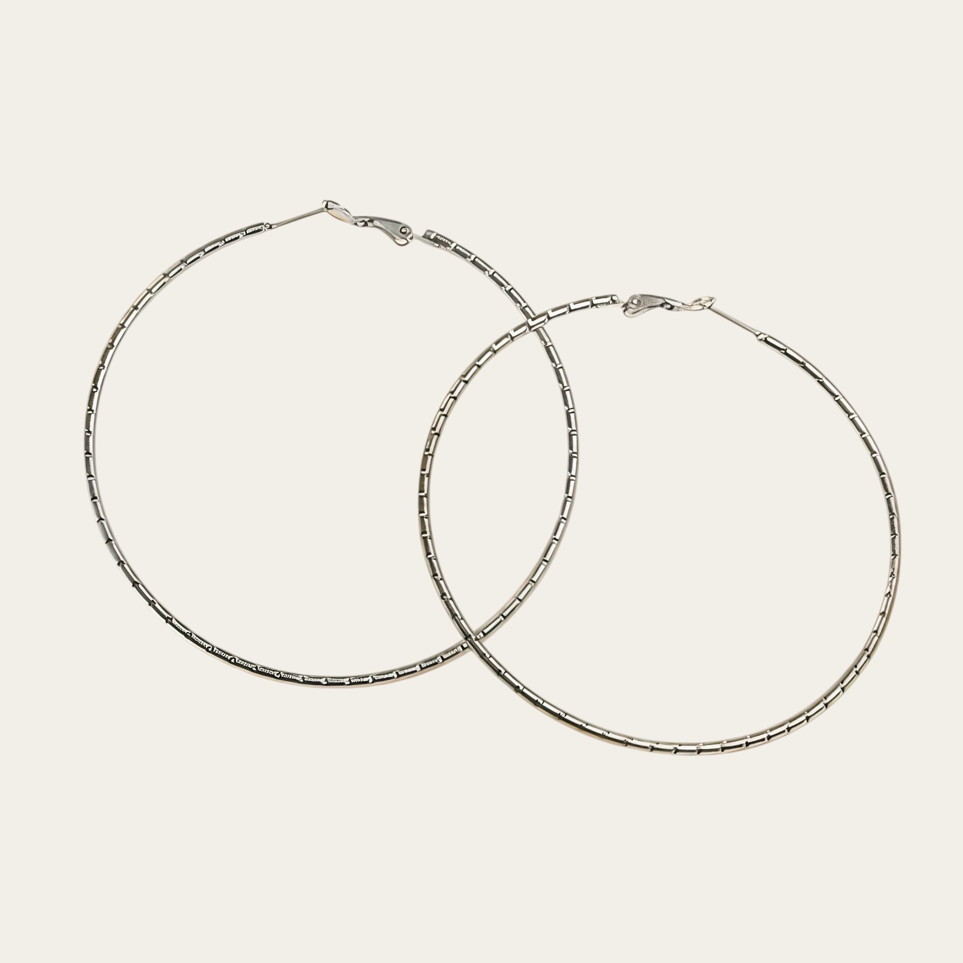Time4Me large silver-tone stainless steel hoop earrings with a 7 cm diameter and textured surface