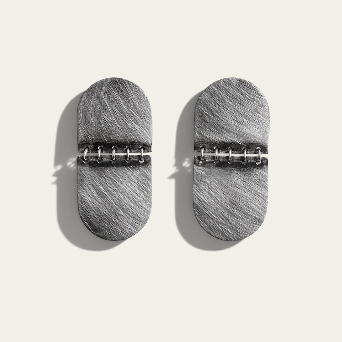 Time4Me silver-toned textured stainless steel oval earrings with a hinged design on a neutral background