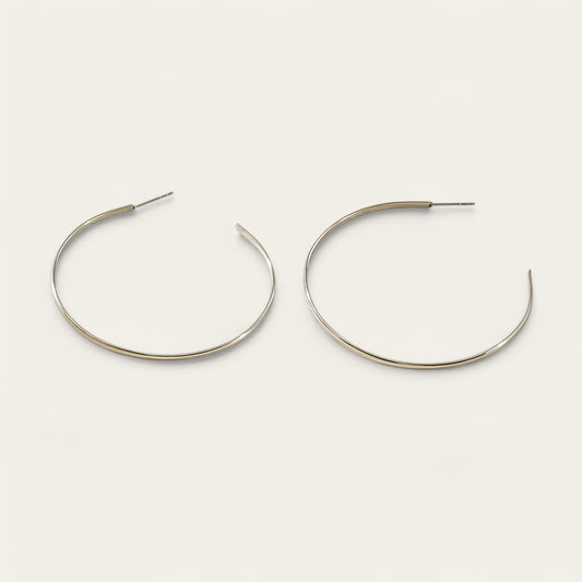 Time4Me silver-tone thin hoop earrings made of durable stainless steel for a versatile and lightweight everyday look.