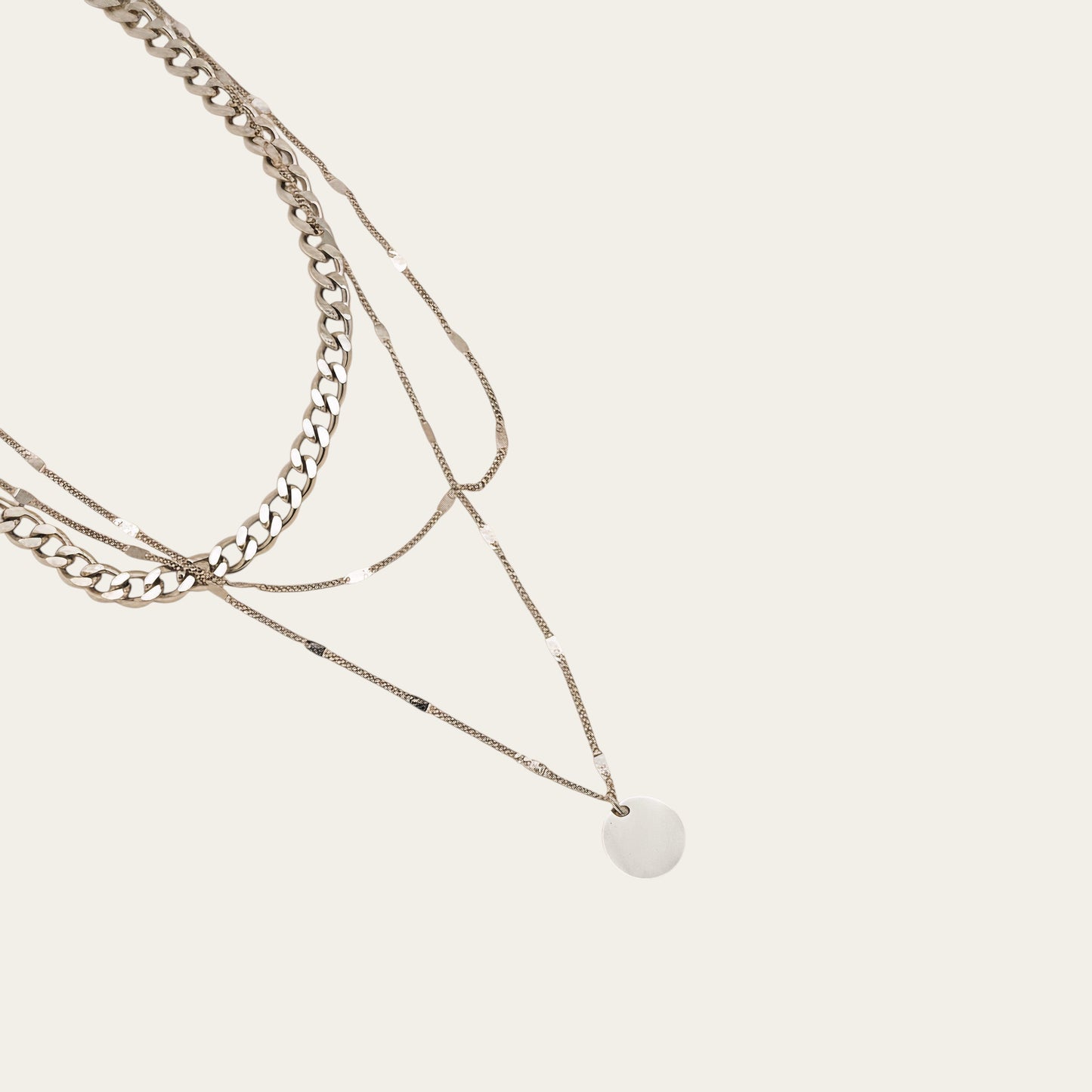 Time4Me silver triple chain necklace with a round pendant made of stainless steel for a layered look.