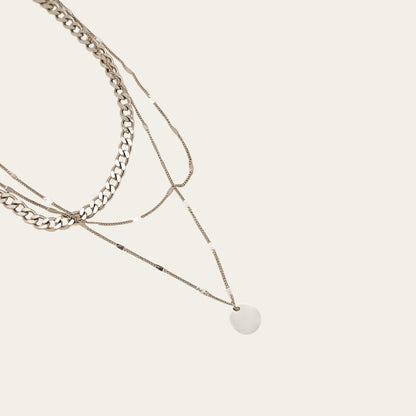 Time4Me silver triple chain necklace with a round pendant made of stainless steel for a layered look.