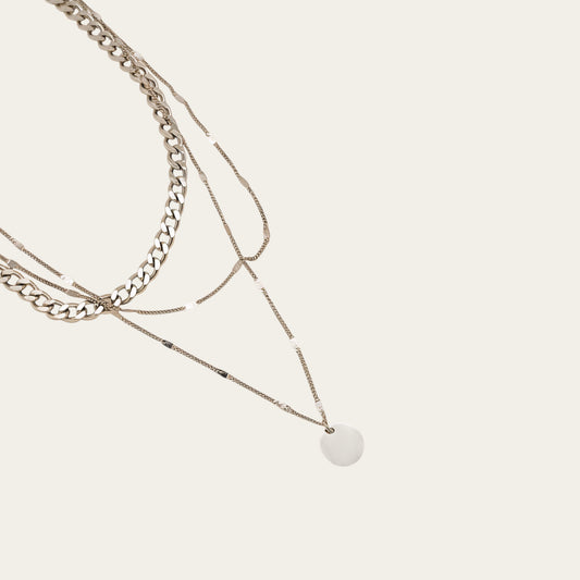 Time4Me silver triple chain necklace with a round pendant made of stainless steel for a layered look.