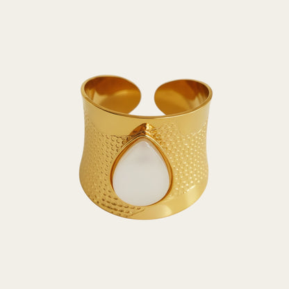 Time4Me wide gold-tone stainless steel adjustable ring featuring a teardrop-shaped white stone and textured finish.