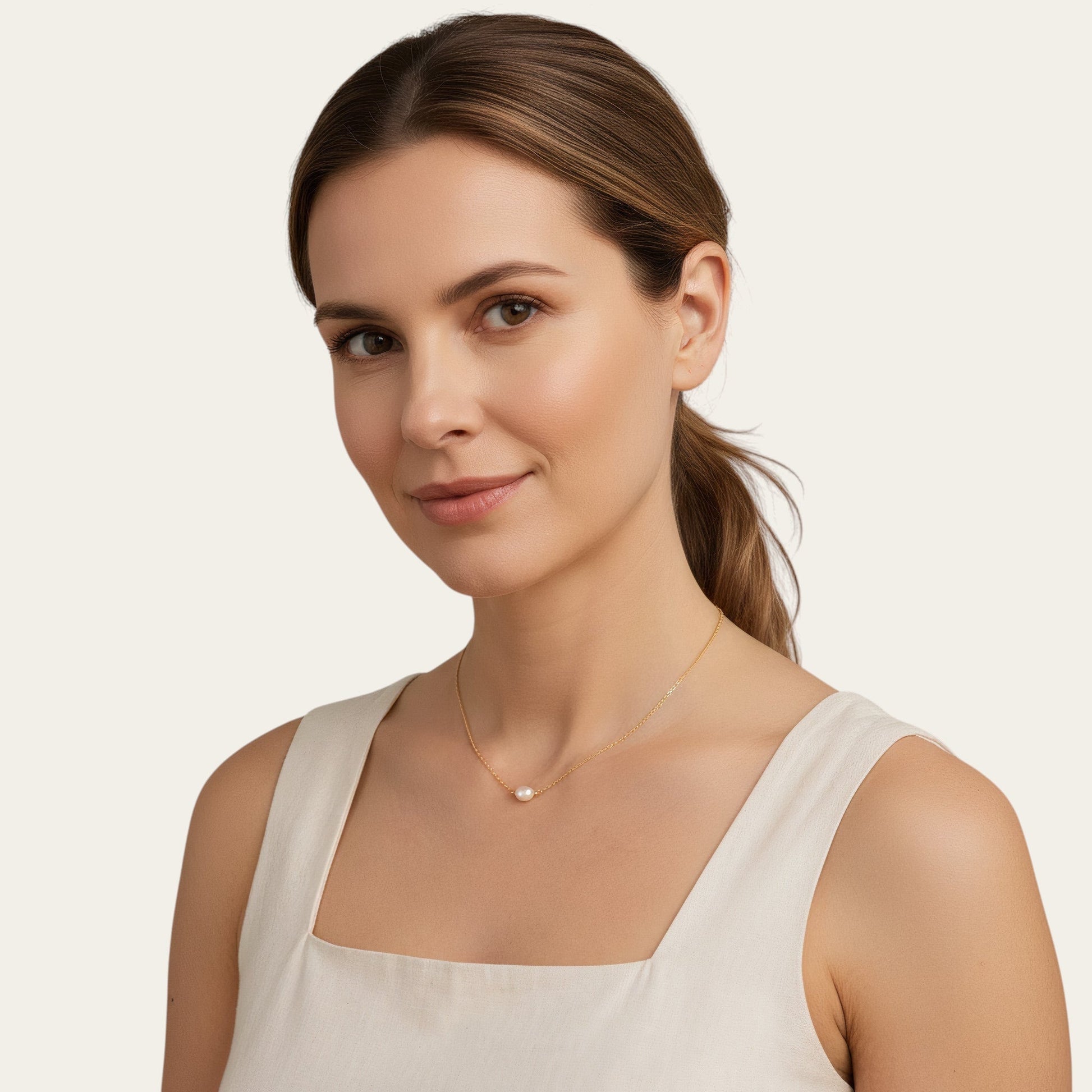 Time4Me Y-shaped silver necklace with pearl accents worn by a woman in a beige top